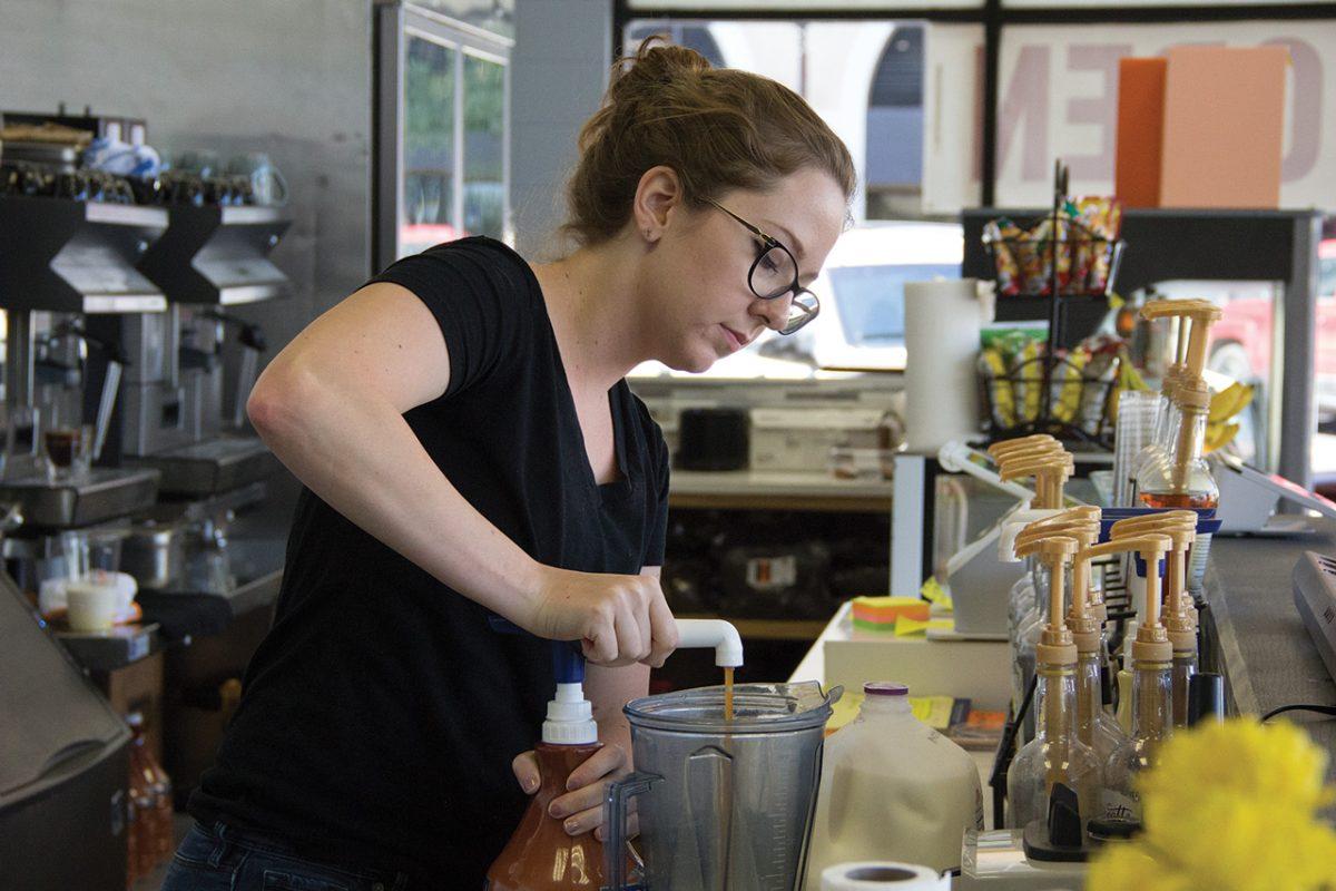Paige Whitis, mass communication senior, makes drinks for customers July 9 at Ciao coffee shop in San Marcos.Photo by Lara Dietrich