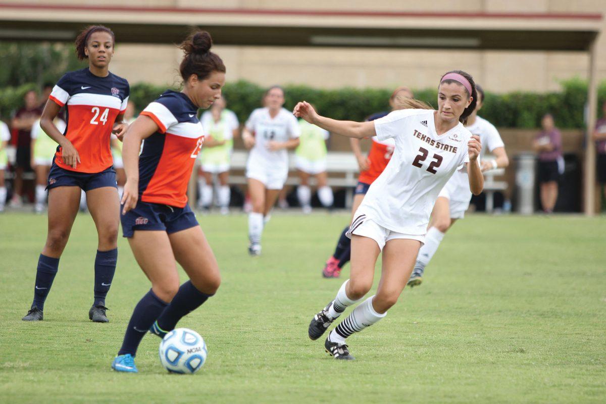 Photo by:Lara Dietrich | Staff PhotographerRachel Grout, sophomore midfielder, defends Nicole Lindsay, Miners junior midfielder, in the Texas State soccer team’s 2-1 loss to UTEP.