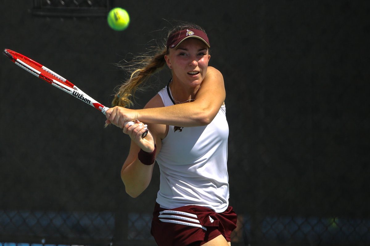 Alex+Jones%2C+junior%2C+shows+determination+on+her+face+as+she+returns+the+ball+to+the+opposing+player.Photo+Courtesy+of+Texas+State+Athletics