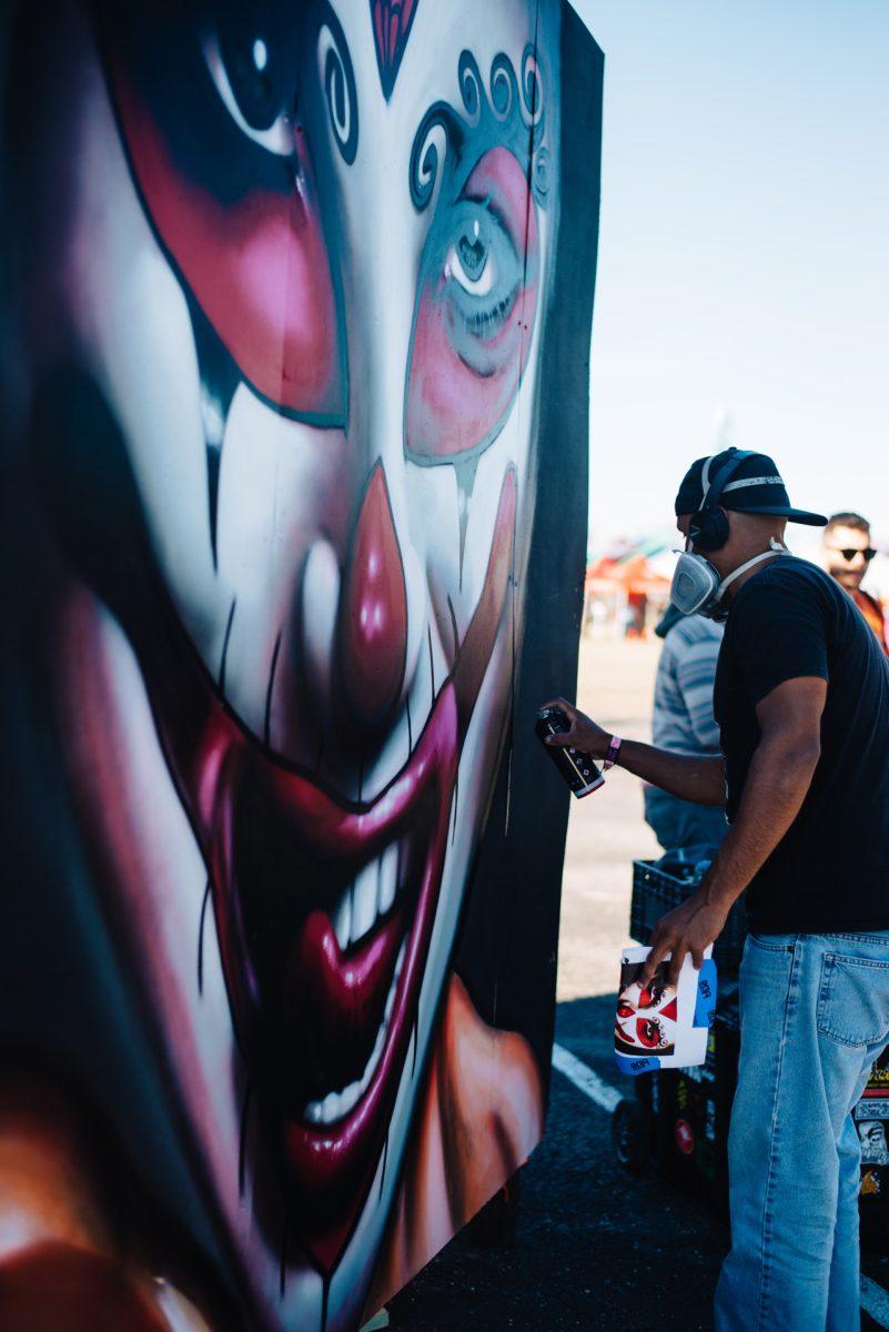 Paul Garson, local artist, put on a live art show at the Mala Luna Music Festival. Garson will be creating murals all weekend during the festival as well as face painting. Photo by Kirby Crumpler | Staff Photographer