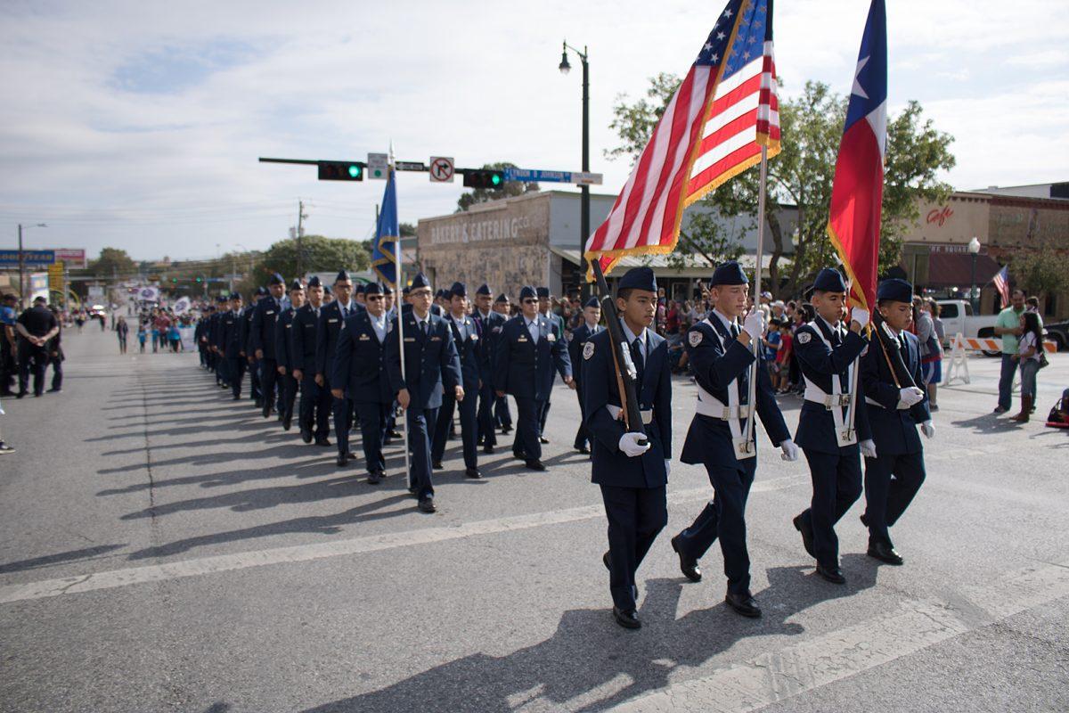 The San Marcos High School JROTC marches through the Square Nov. 11 during the Veterans Day Parade.Photo by Lexi Altschul | Staff Photographer