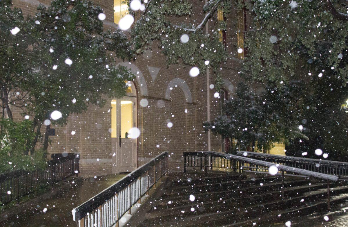 Students gather outside to witness the snowfall on Dec. 7.Photo by Josh Mends | Staff Photographer