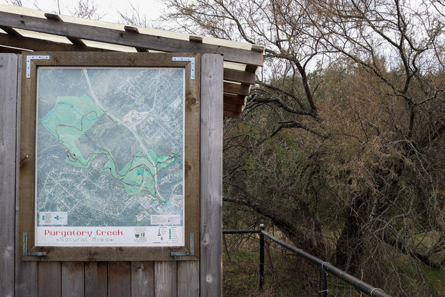 A map of Purgatory Creek Natural Area hangs near one of the trailheads to the park.
Photo by Tyler Jackson | Staff Photographer