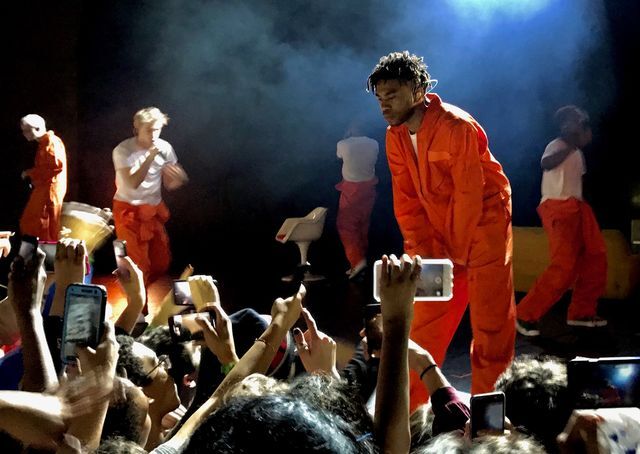 Brockhampton founder Kevin Abstract leans over the stage to look at audience members during a performance at the Aztec Theatre in San Antonio on Jan. 19.
Photo by Victor Rodriguez | Multimedia Editor