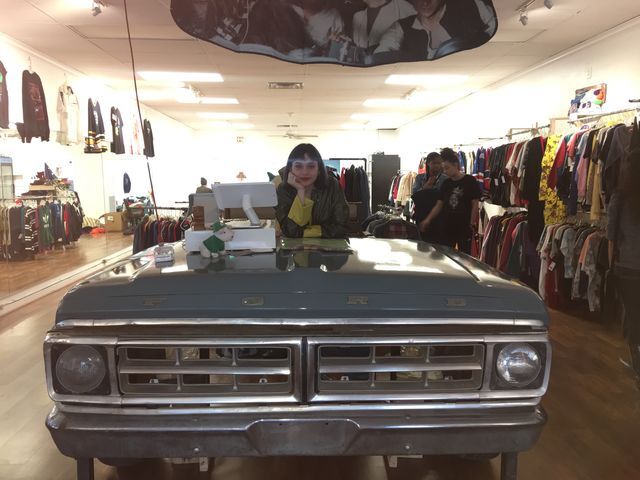 Alejandra Guerrero, manager at Monkies Vintage, poses at the check out counter.
Photo by Constunce Brantley | Lifestyle Reporter