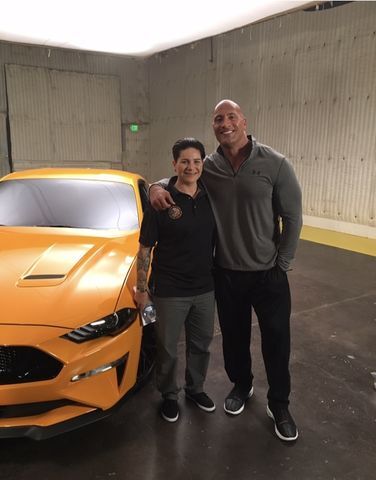 Actor Dwayne ‘The Rock’ Johnson awarded Marlene Rodriguez, recreational therapy senior, army veteran and Purple Heart recipient, the Ford Go Further award along with a 2018 Mustang for her admirable work in the veteran community.
Photo courtesy of Marlene Rodriguez.