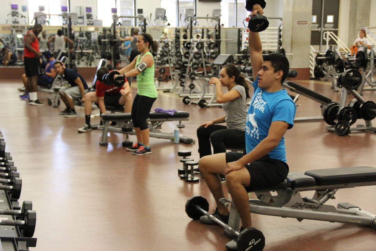Photo by:Lara Dietrich | Staff PhotographerOscar Robles, senior exercise and sports science major, works out Aug. 28 at the Rec Center.