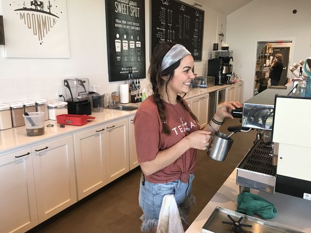 Payton Morey, marketing sophomore, making a latte at Summer Moon.
Photo by
Sonia Garcia | Lifestyle Reporter