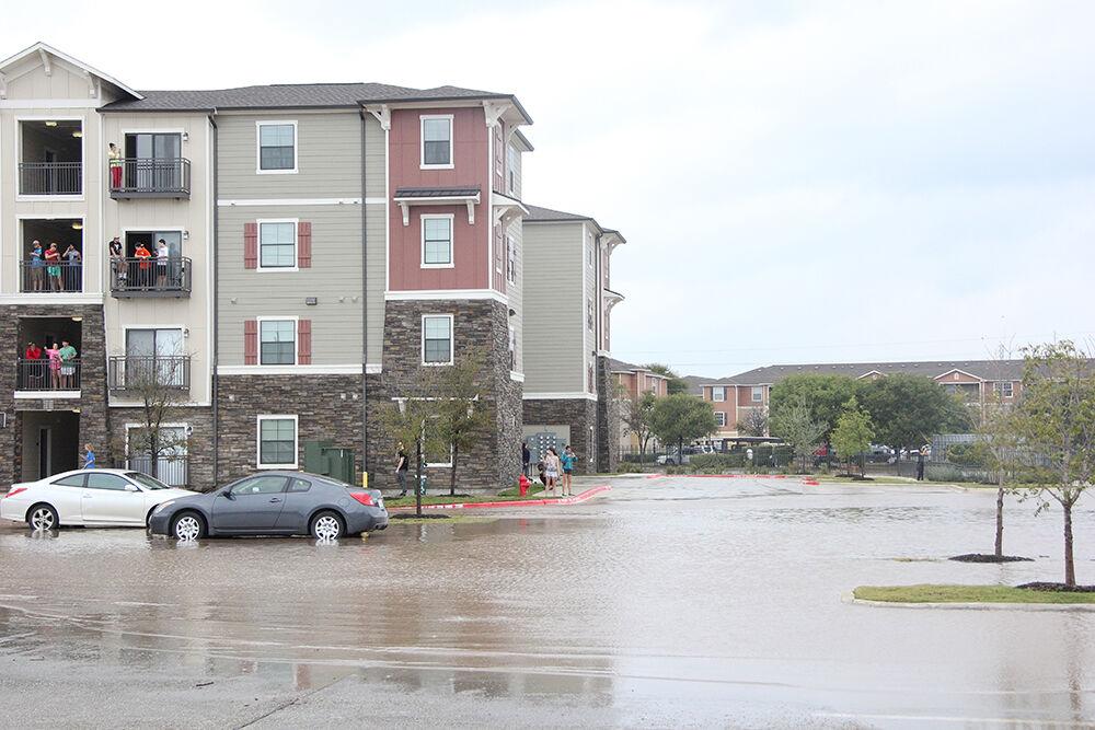 Photo by: Lara Dietrich | Staff Photographer
The Blanco River flooded into the parking lot and some of the units at Aspen in San Marcos.