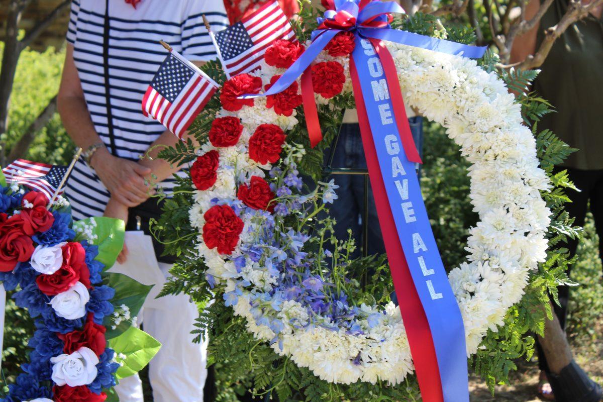 Memorial Day wreaths sit on display, Monday, May 28, 2018, during a Memorial Day ceremony in San Marcos.