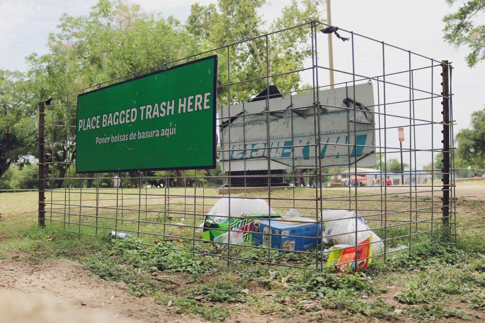 Designated areas to dispose of bagged trash are placed near the river at Rio Vista Park.
