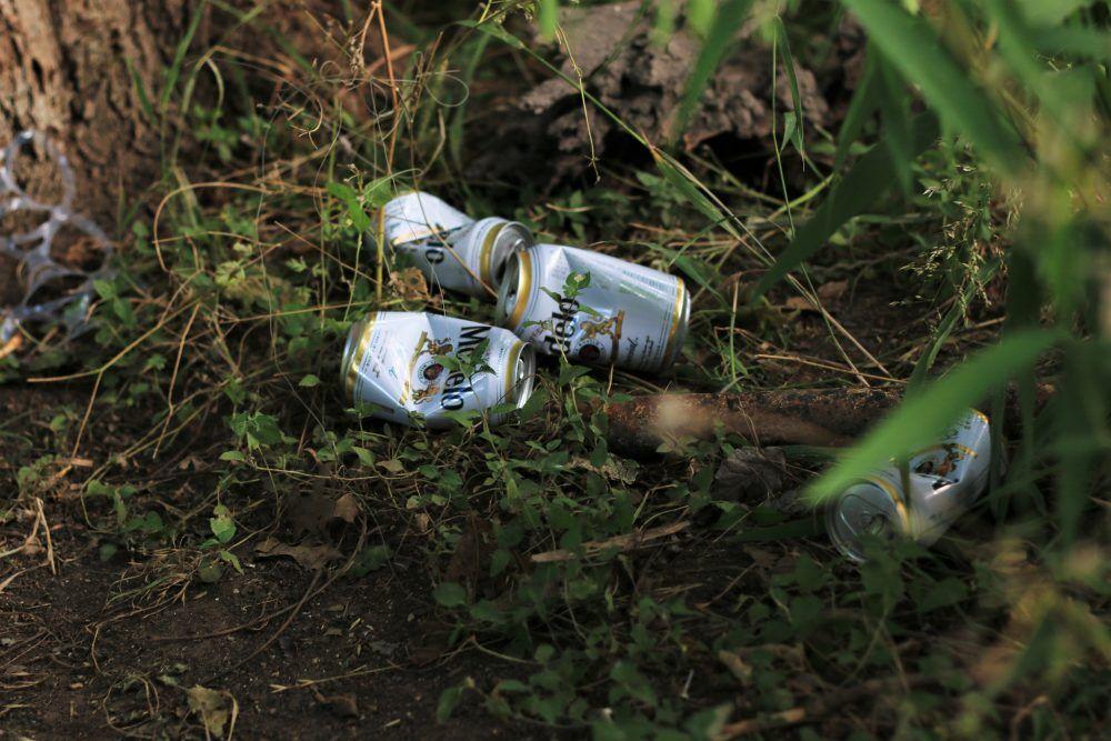 Empty+beer+cans+thrown+July+5+alongside+the+San+Marcos+River.