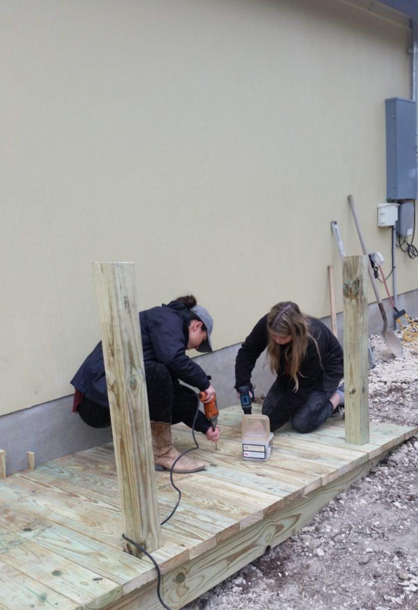 Students are building wheelchair ramps as part of the Service-Learning Excellence Program.Photo By Malarie Ohrabka