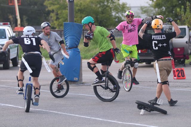 
Unicycle football players wheel toward a touchdown, Oct. 14.


Photo By Kate Connors
