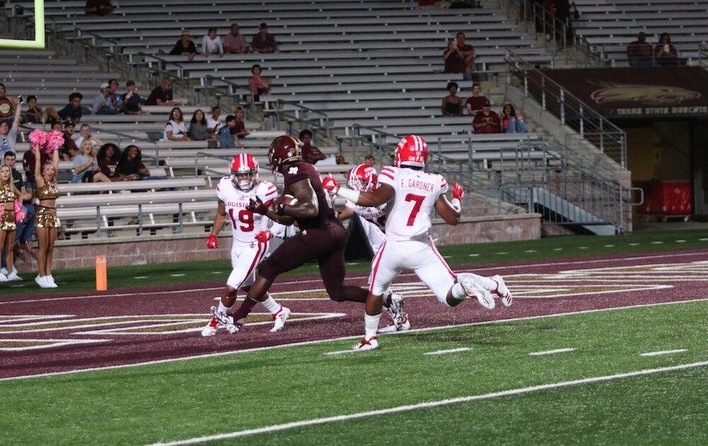 
Tight end, Keenen Brown winds his way through Louisiana defenders to get into the end zone.


Photo Courtesy of Kate Connors
