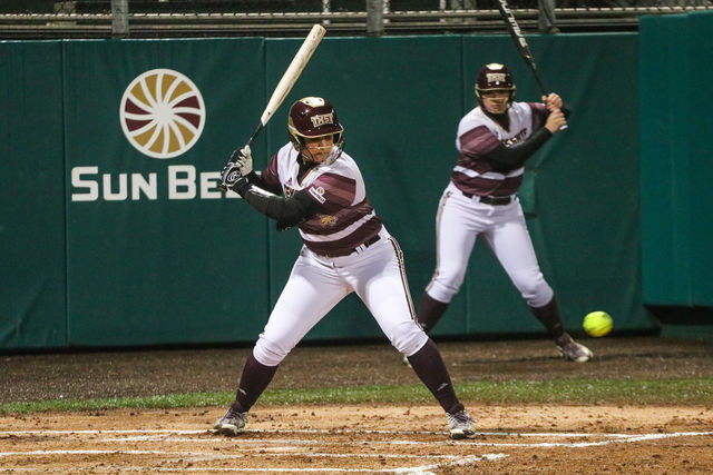 Hailey MacKay eyes the pitch as she begins to swing at the ball. Photo by Kate Connors