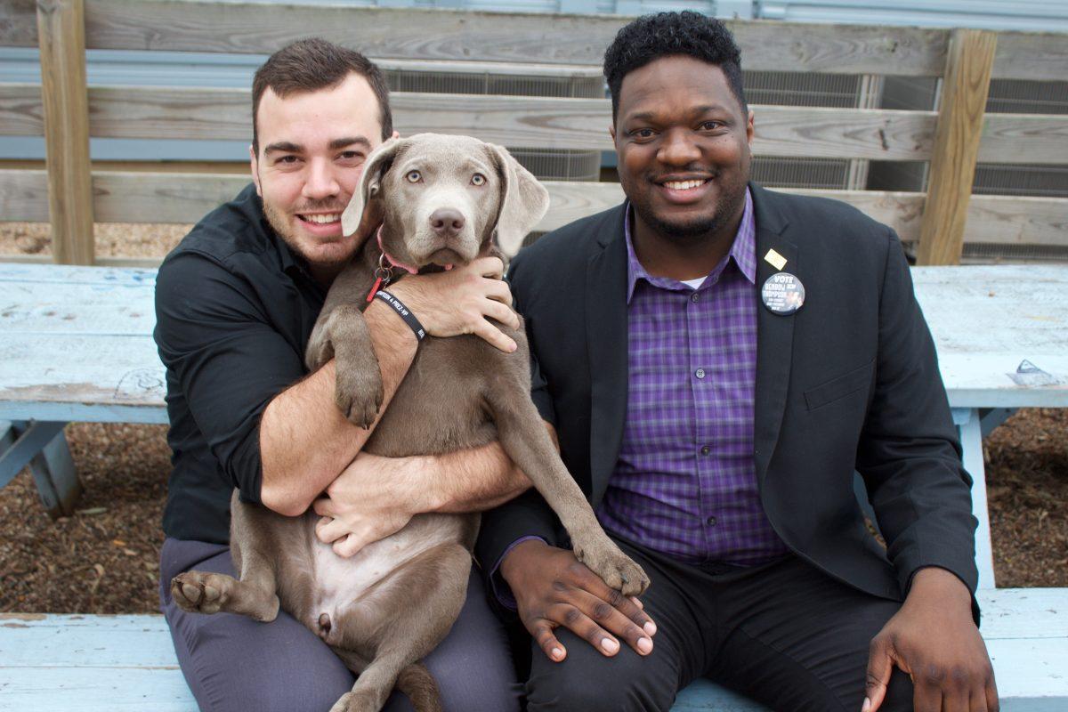 Benbow and Thompson pose together with their campaign dog, Millie.Photo by Camelia Juarez