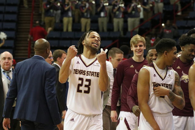 Alex Peacock celebrates along with his team after beating South Alabama 79-67 on March 15. Photo by Kate Connors.