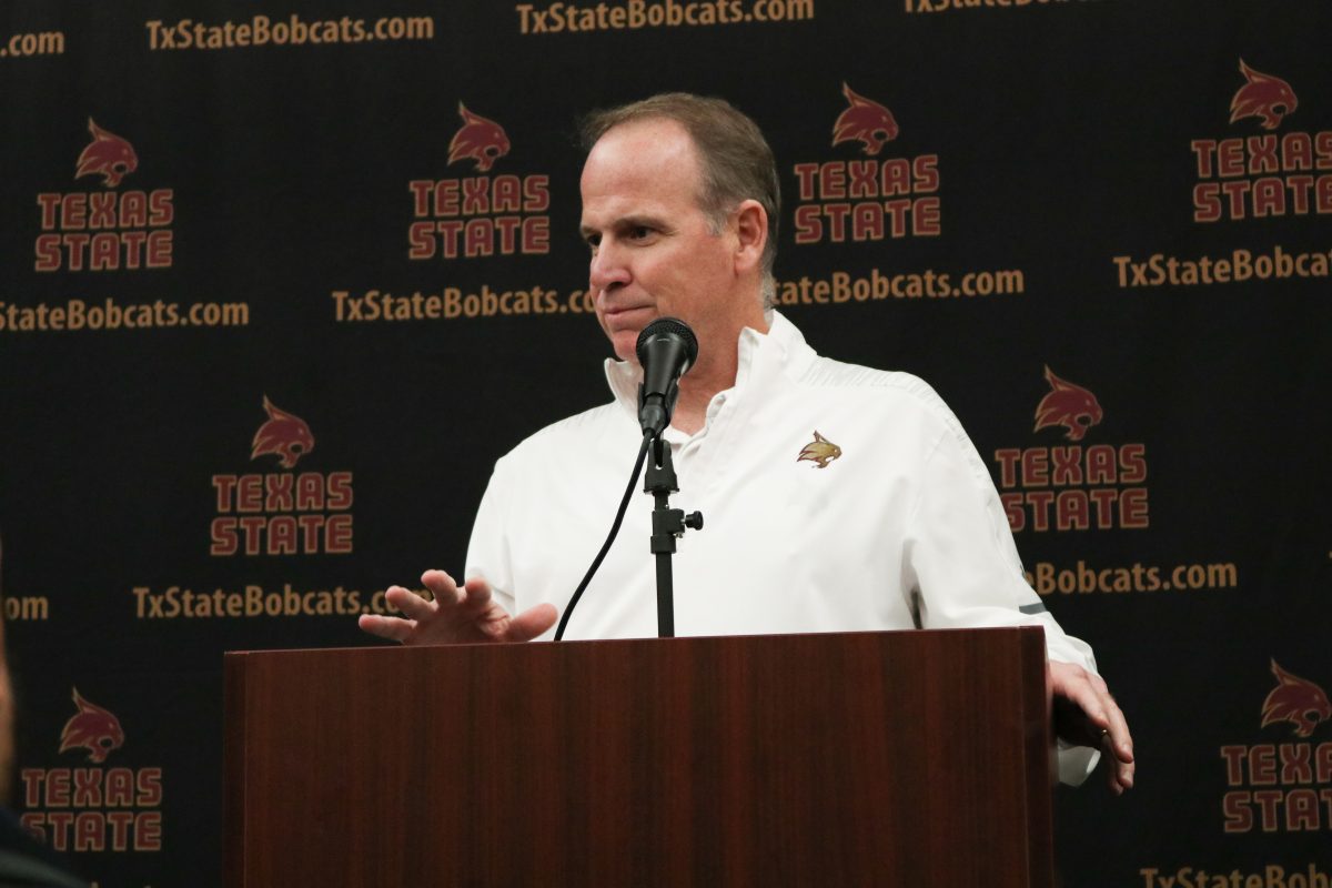 Offensive Coordinator Bob Stitt address media members Feb. 6 on national signing day.Photo by Kate Connors.