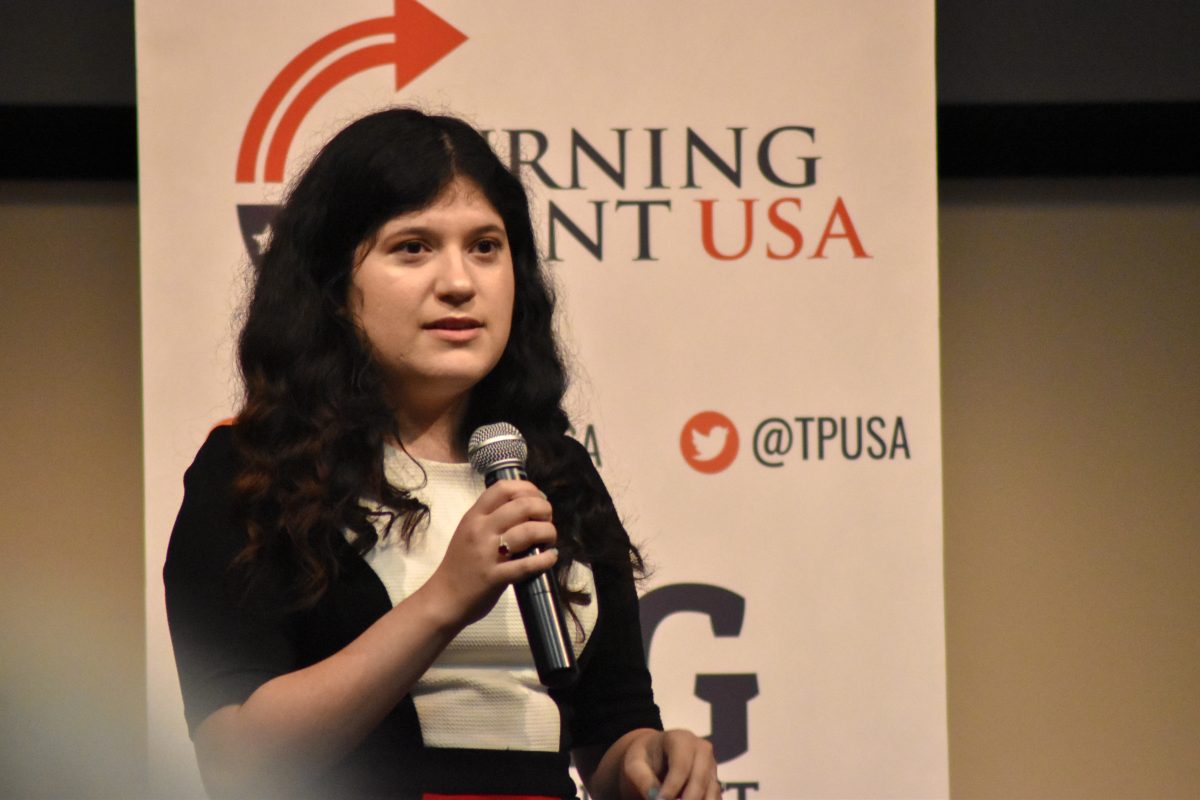 President of Texas State’s chapter of Turning Point USA Stormi Rodriguez speaks Oct. 24 before a keynote from TPUSA founder Charlie Kirk and communications director Candace Owens.