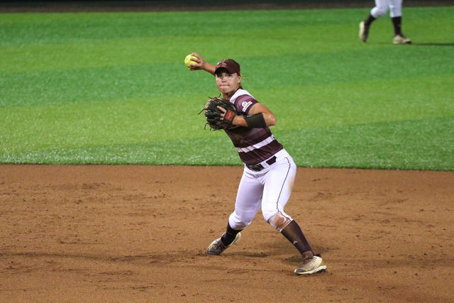 Tara+Oltmann+throws+the+ball+back+to+first+base+to+get+the+ULM+baserunner+out.+Photo+by+Kate+Connors.