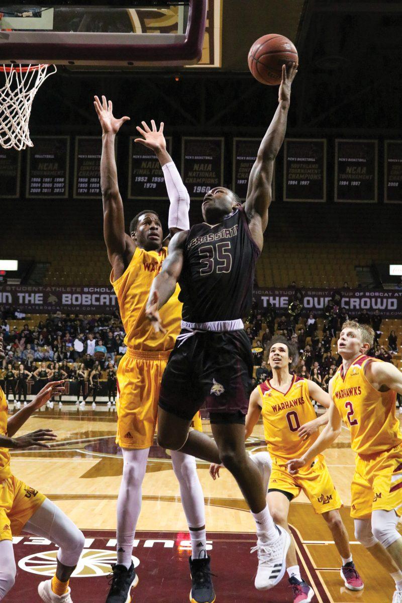 Guard Jaylen Shead attempts a layup Feb. 21 during the basketball game against ULM. Photo by Kate Connors.