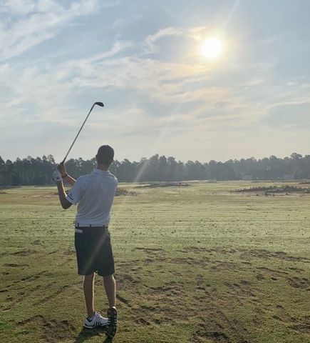 Calvin Ross swings into the sun at the US Amateur Championship. Photo courtesy of Mackenzie Clark.
