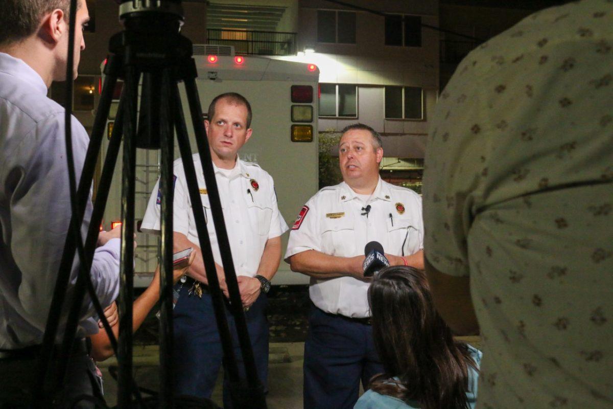 Fire Marshal Kelly Kistner (left) and Fire Chief Les Stephens (right) address the media Sept. 20 at the Vie Lofts apartments in San Marcos. 162 occupants were being evacuated from the apartment building due to stability issues and other safety concerns.