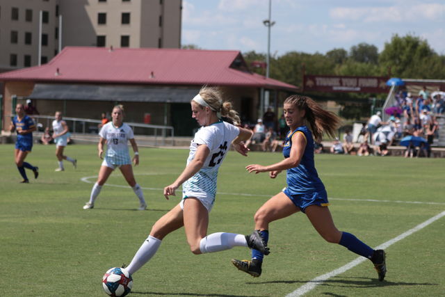 Forward+Kaylee+Davis+keeps+the+ball+away+from+McNeese+and+looks+to+pass+the+ball+to+her+teammate+in+the+Sept.+15+game+at+Bobcat+Soccer+Complex.