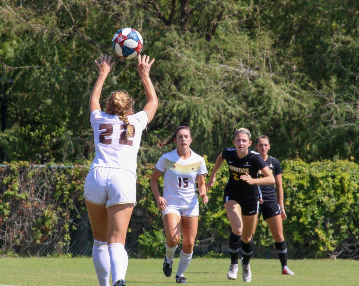 Texas State defender Addison Gaetano, (22), attempts to throw a soccer ball to her teammate, Jessica Pikoff, (15), during the first half against Appalachian State Oct. 6 at the Bobcat Soccer Complex. Photo credit: Jaden Edison