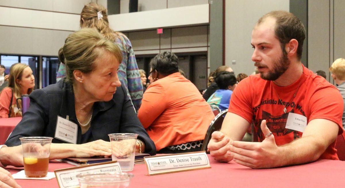 Texas State University President Dr. Denise Trauth speaks with student Ethan Pena Sept. 30 at the Student Government Roundtable in the LBJ Ballroom.