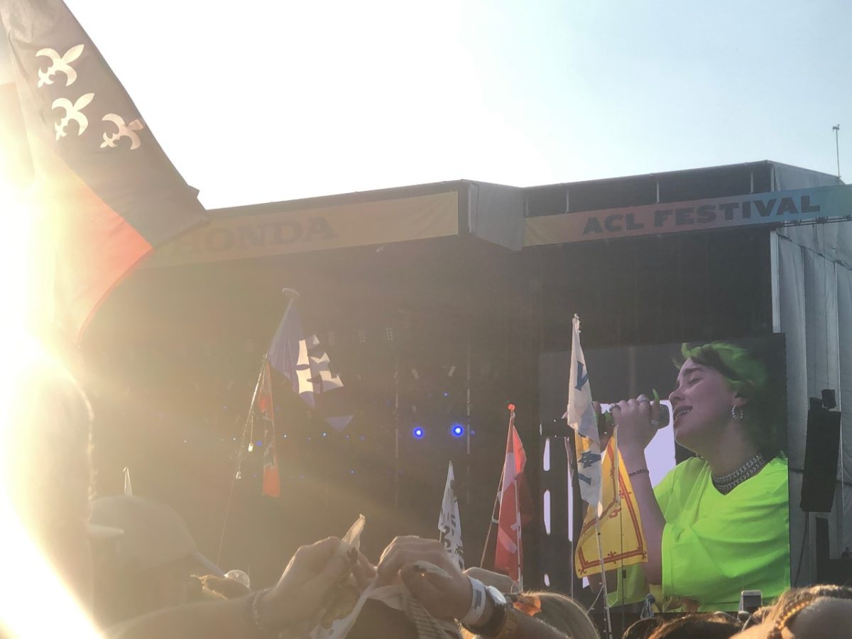 Billie Eilish performs from afar on the Honda stage.