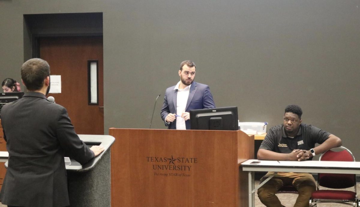 Student Government Director of Finance Preston Nieves addresses Student Body Vice President Tucker Thompson and President Corey Benbow.