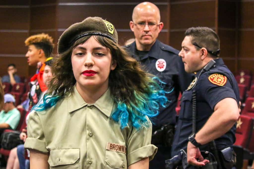 Texas State student Sabrina Chapa exits a Student Government meeting after being asked to leave by University Police Department officers, Monday, April 8, 2019, in the LBJ Teaching Theater at Texas State University. Chapa was one of several student protesters attending the meeting to publicly speak out against conservative organization Turning Point USA.