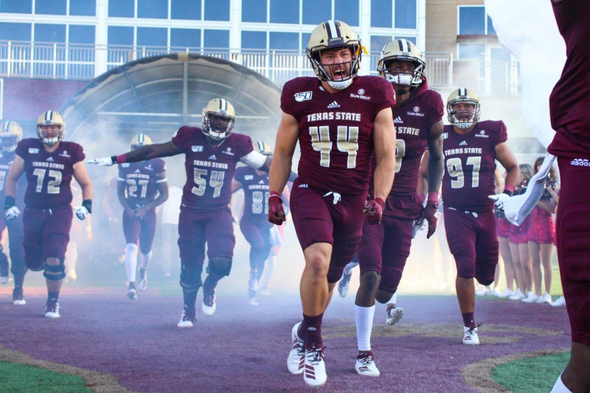 Kate ConnorsJunior linebacker John Brannon (44) and the Bobcats run onto the field in excitement before the Sept. 29 game against Nicholls State at Bobcat Stadium.