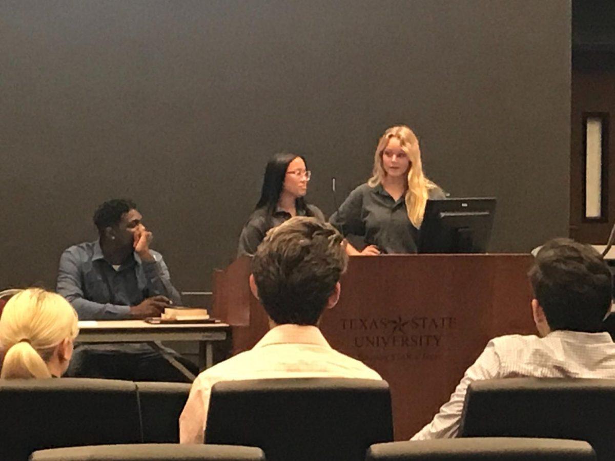 Student Government hearing from Human Environmental Animal Team President Callie Smith and Vice President Leah Bach (standing) during its Feb. 17 meeting in the LBJ Student Center.