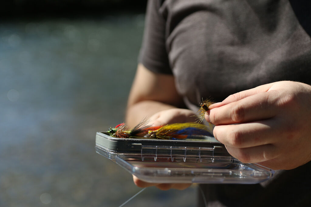 San Marcos resident Charlie Neff takes a look at fishing bait prior to fly fishing for the first time, Saturday, Feb. 1, 2020, at Thompson Island. Fly fishing is the practice of fishing while using an artificial fly as bait.