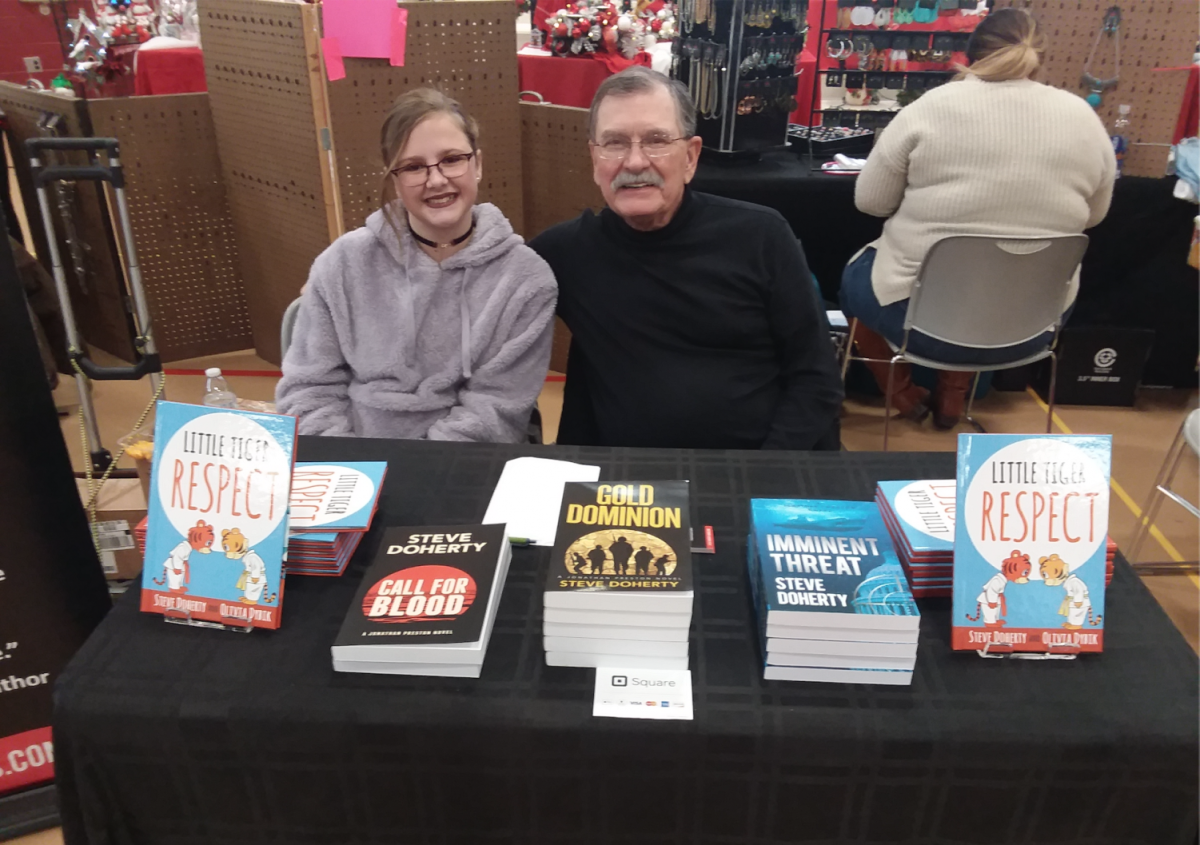 Co-authors of “Little Tiger” Series Olivia Dybik and Steve Doherty showcase their books at the St. Matthew’s Hometown Bazaar in Gahanna, Ohio, Tuesday, November 19, 2019. Photo credit: Gabriella Germann