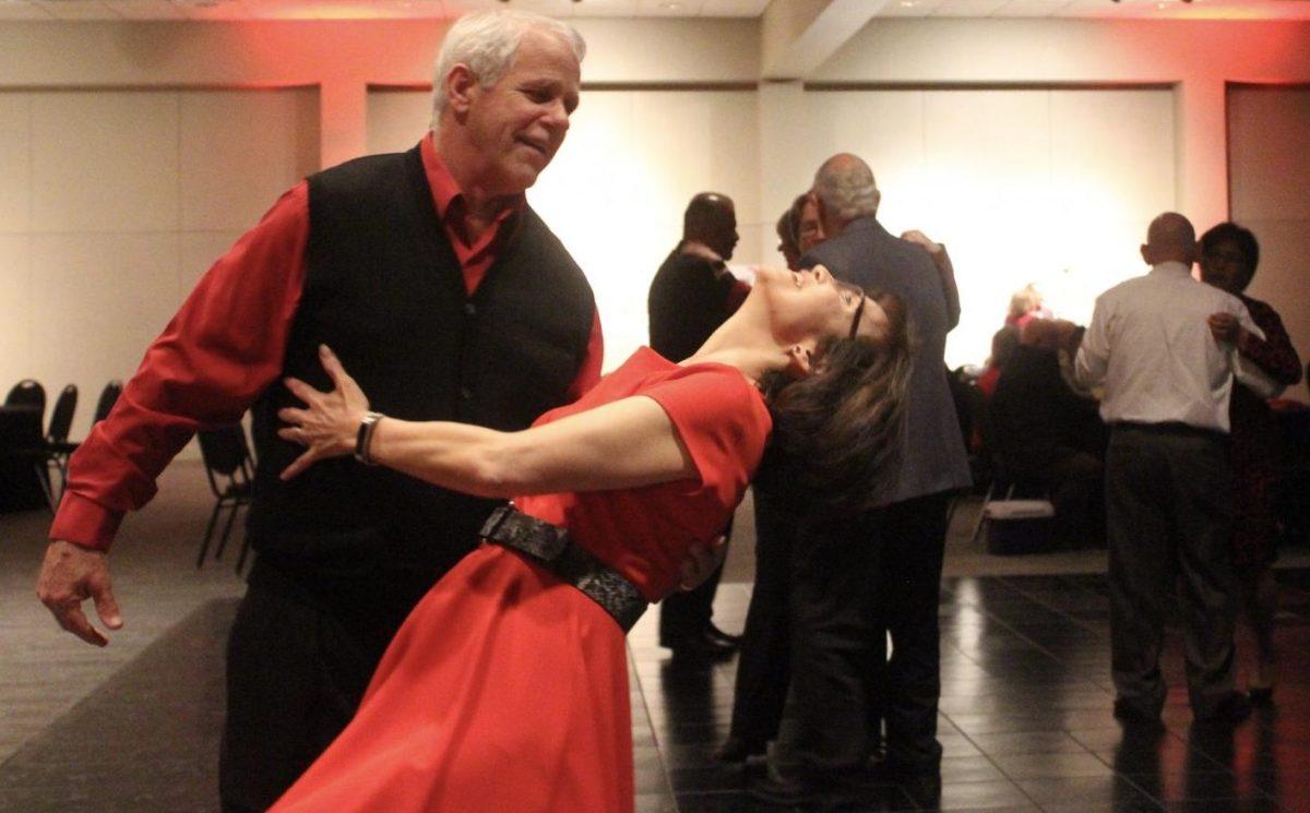 James Glasgow (left) and Van Bui dance, Friday, Feb. 14, 2020, during the 21st Annual Golden Sweetheart’s Ball at the San Marcos Activity Center.