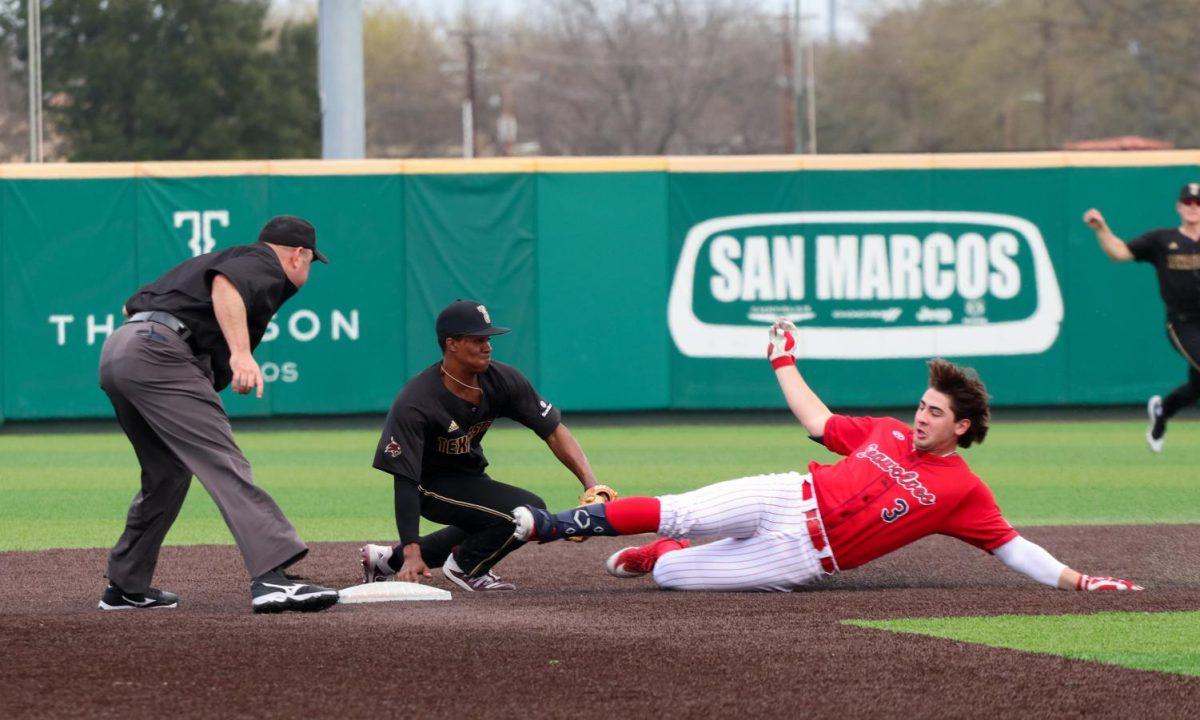 Texas State senior infielder Jaxon Williams tags Stony Brook senior first baseman and outfielder Chris Hamilton as he slides to second base, Sunday, Feb. 16, 2020, at Bobcat Ballpark. (Kate Connors)