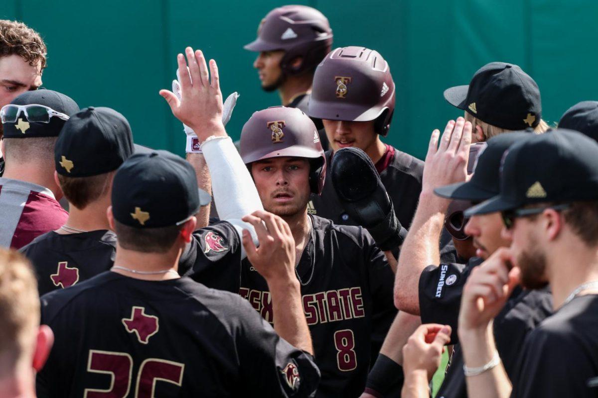 Texas+State+junior+infielder+Dalton+Shuffield+high+fives+his+teammates+after+scoring+the+first+run+for+the+Bobcats%2C+Sunday%2C+Feb.+16%2C+2020%2C+in+a+game+vs.+Stony+Brook+at+Bobcat+Ballpark.