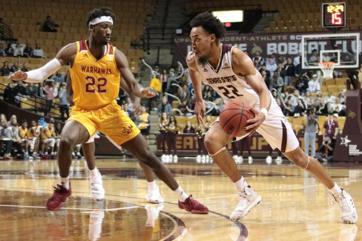 Texas State Guard Nijal Pearson, (22), runs down the court towards the basket with the ball Thursday, January 30, 2020, at Strahan Arena. Photo credit: Katelyn Lester