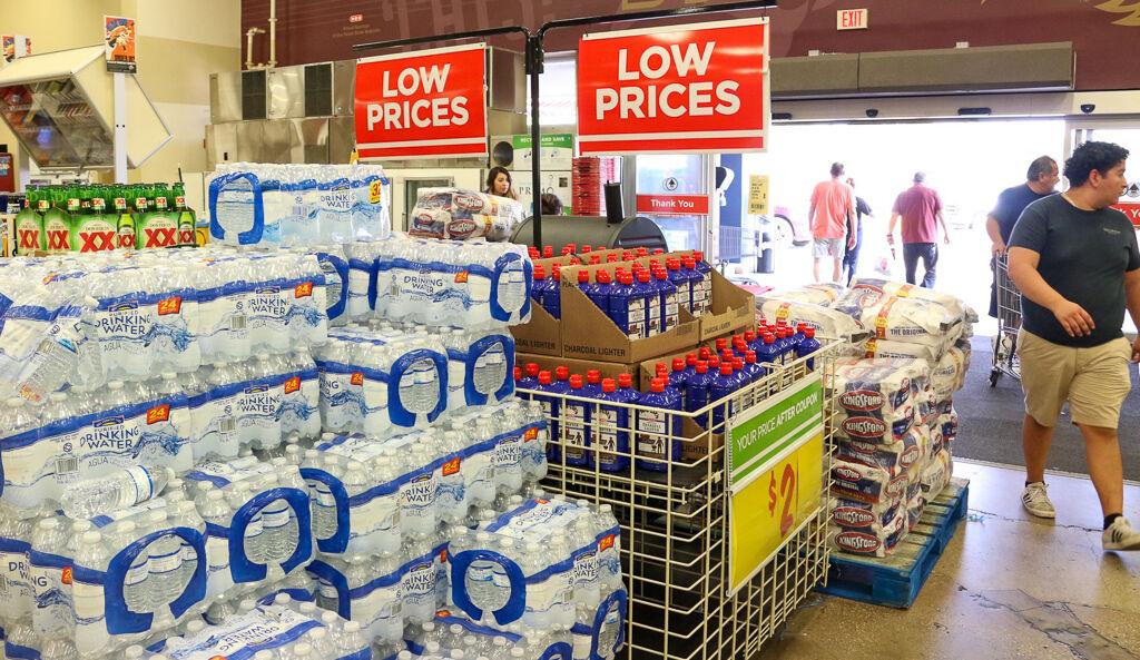 Water, charcoal lighters, coolers, alcoholic beverages and a barbecue pit, moved from individual aisles to the front of the store due to remodeling, sit on sale, Monday, May 27, 2019 in H-E-B at 641 E Hopkins St.