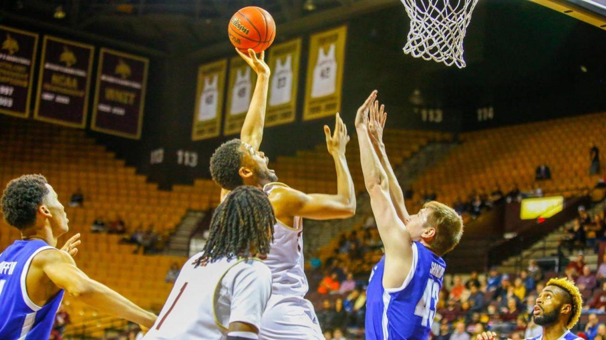Senior guard Eric Terry shoots over the Mavs’ defender in the triple-overtime battle over the University of Texas-Arlington on Friday, February 28, 2020. Photo courtesy of Texas State Athletics.