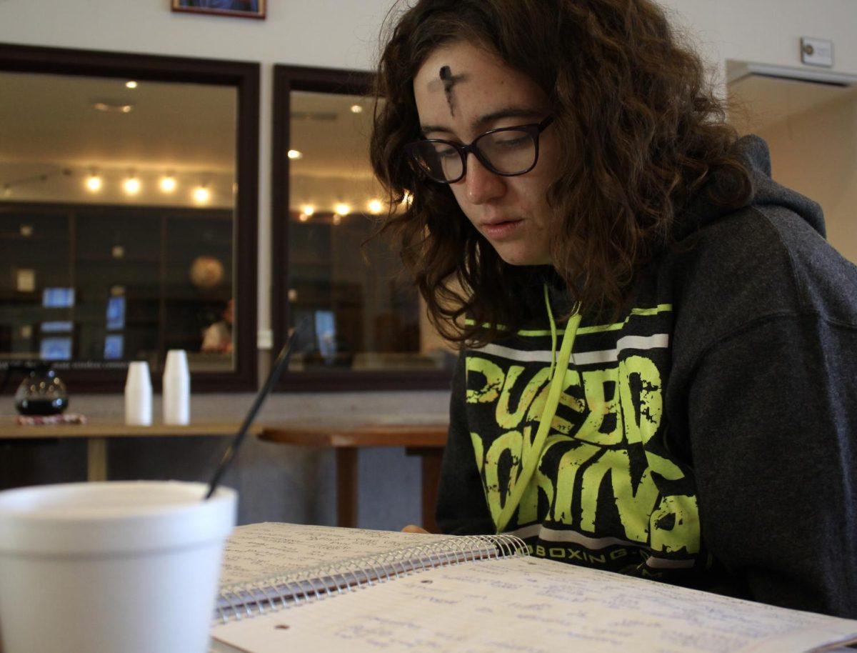 Texas State elementary education sophomore Kamryn Macha studies for an exam after receiving the cross of ashes on Ash Wednesday, Feb. 26, 2020, at Our Lady of Wisdom University Parish. Ash Wednesday is a Christian holy day of prayer and fasting that always falls on the first day of Lent, a 40-day season of penitential preparation for Easter.