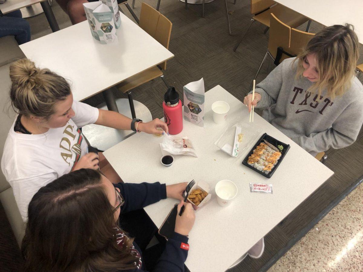 Texas State students Annabelle Nichols, Carol Gebhart, and Daisy Moore eating dinner Friday, Feb. 21, 2020 at Jones Dining Hall on campus.