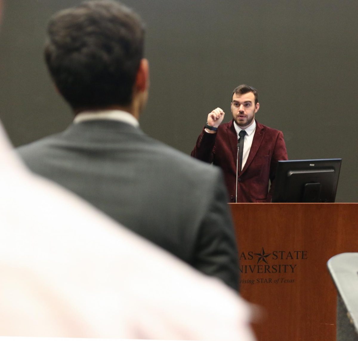 Student Government Vice President Tucker Thompson counts those in favor of a bill to be read by a text-to-voice bot, Monday, March 3, 2020, in the LBJ Teaching Theater.