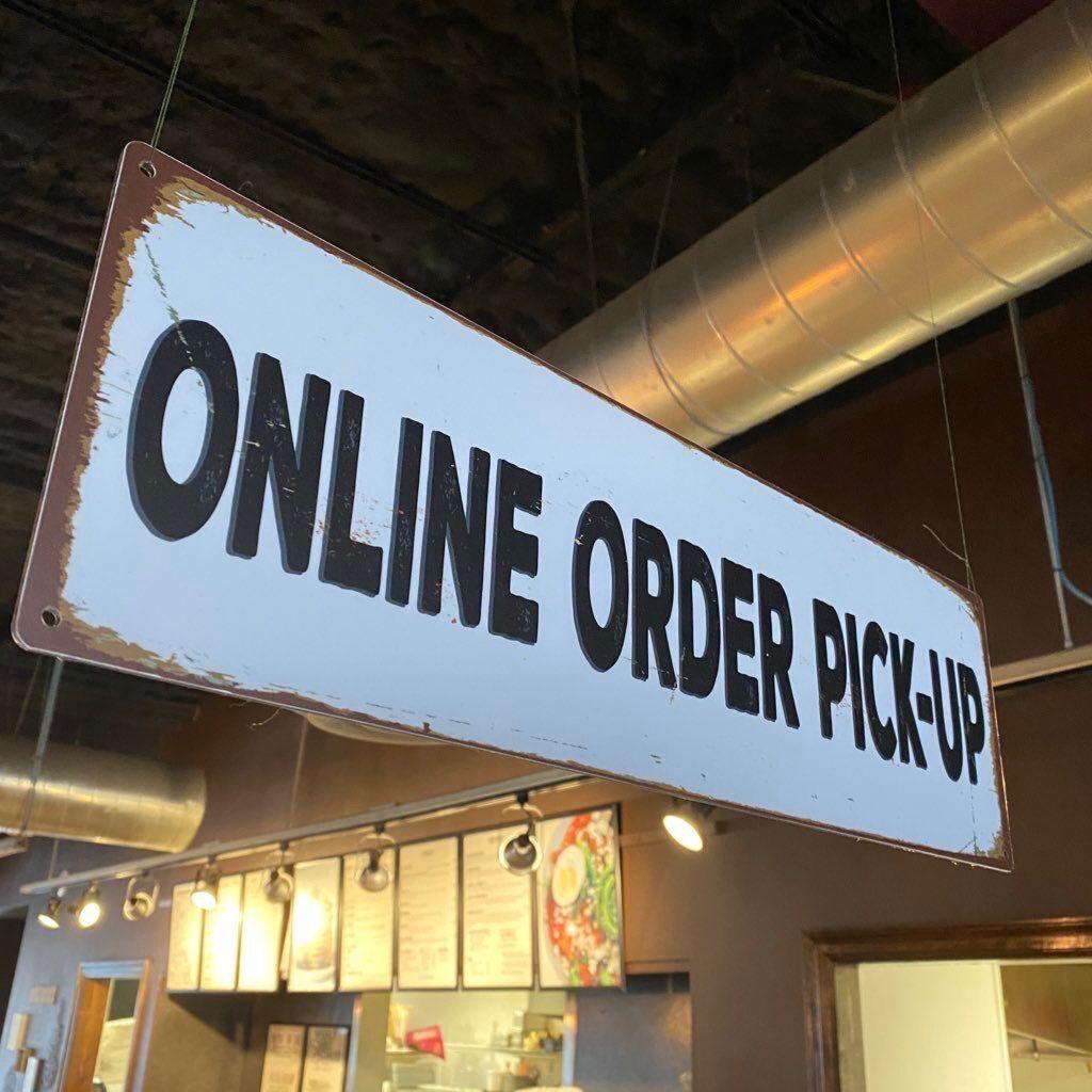 An+online+order+pick-up+sign+hangs+above+the+barista+bar+Thursday%2C+March+19%2C+2020+at+Mochas+%26amp%3B+Javas%26%238217%3B+N+LBJ+Drive+location.+All+Mochas+%26amp%3B+Javas+locations+are+open+for+to-go+and+curbside+pickup+services.+Photo+credit%3A+Photo+courtesy+of+Mochas+%26amp%3B+Javas