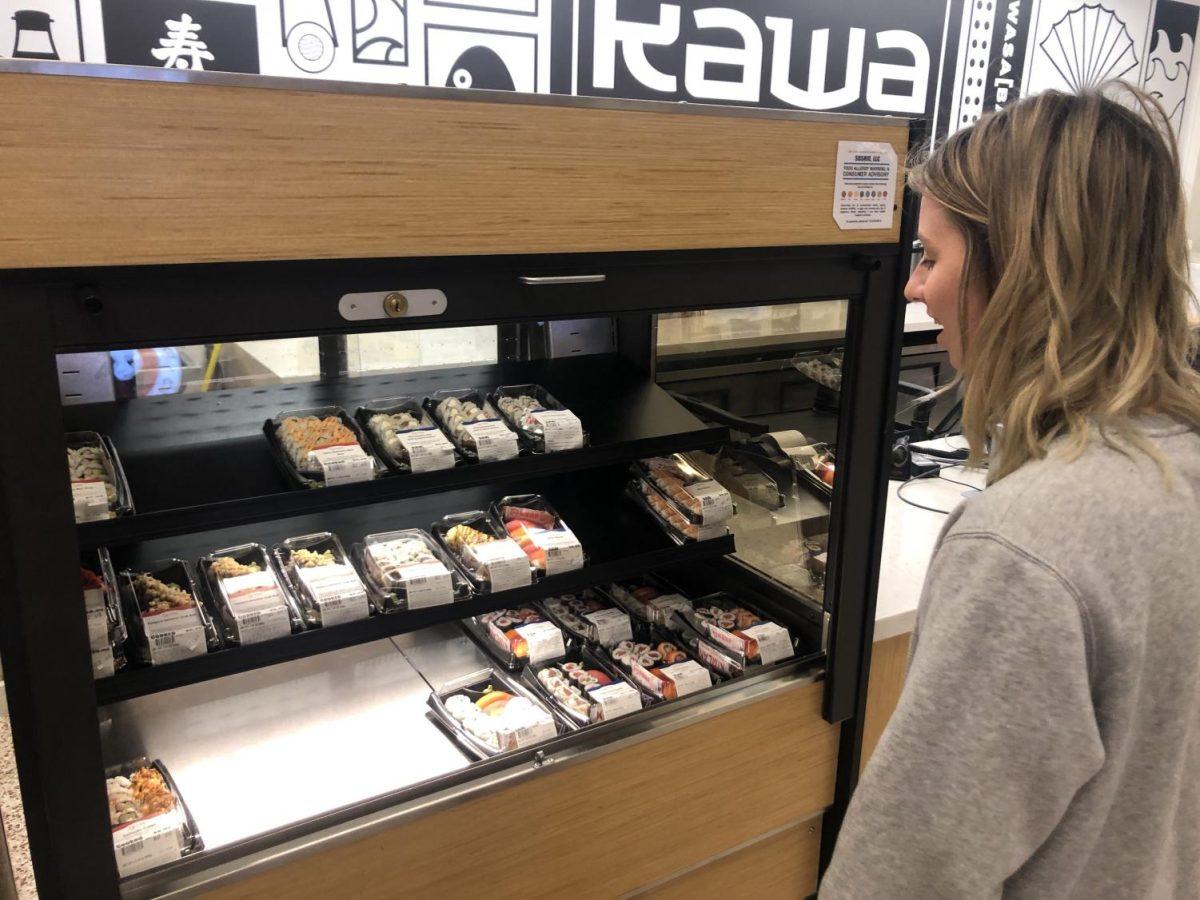 Texas State student Daisy Moore picking out sushi for dinner Friday, Feb. 21, 2020 at Jones Dining Hall on campus.
