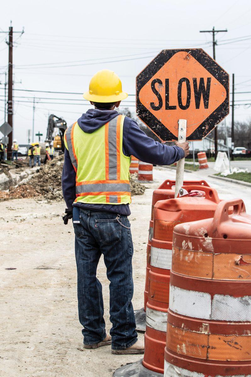 A construction worker awaits incoming traffic Feb 1 on Mill Street.Photo by Richard Molnar